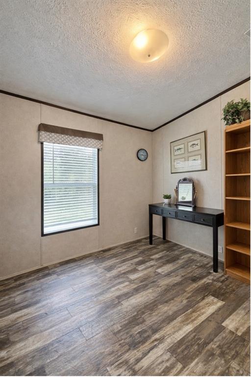 750 Waterfront Row Quitman, TX 75783 - Photo 15 of 32 a view of a living room with kitchen view and wooden floor