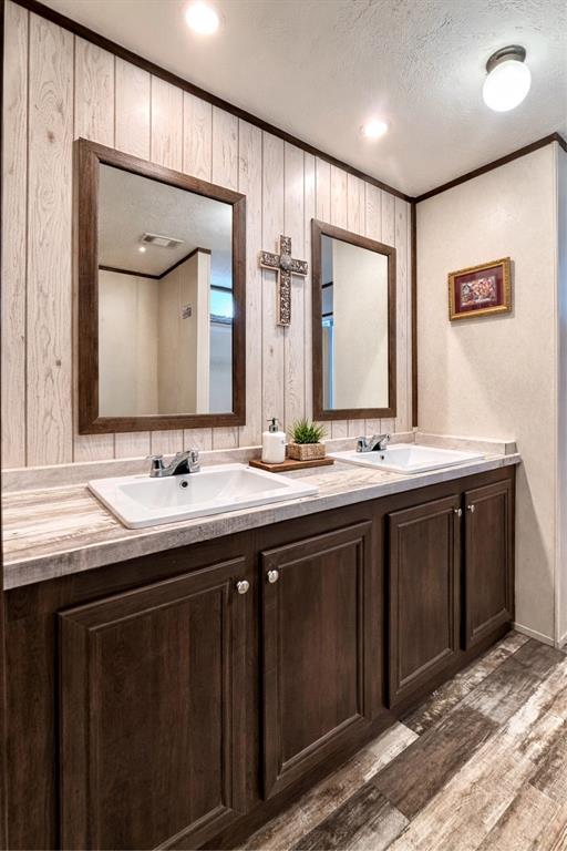 750 Waterfront Row Quitman, TX 75783 - Photo 19 of 32 a bathroom with a double vanity sink and a mirror