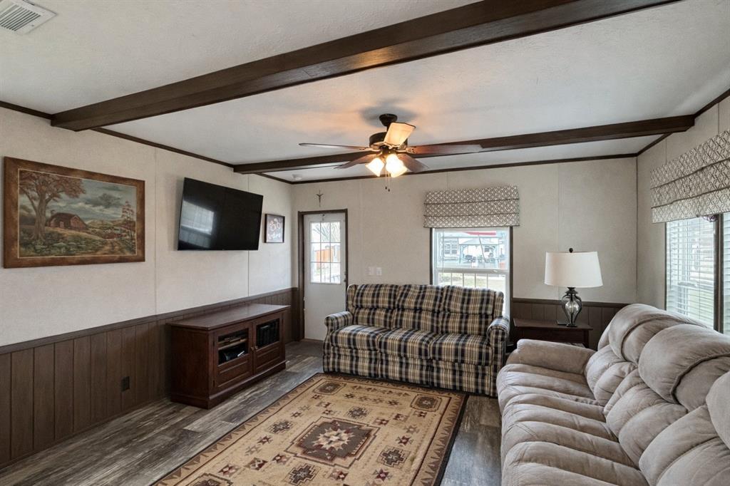 750 Waterfront Row Quitman, TX 75783 - Photo 6 of 32 a living room with furniture and a flat screen tv