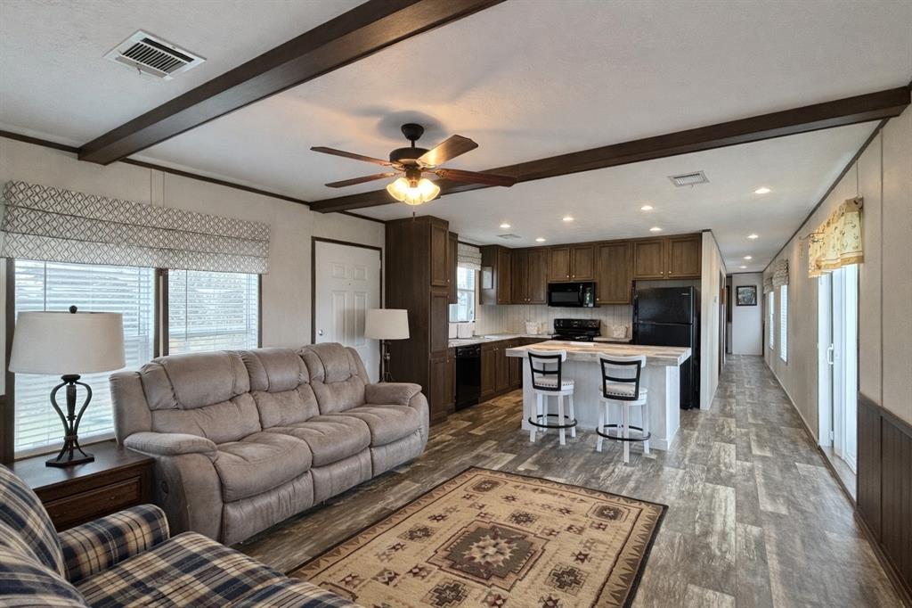 750 Waterfront Row Quitman, TX 75783 - Photo 7 of 32 a living room with furniture and a wooden floor
