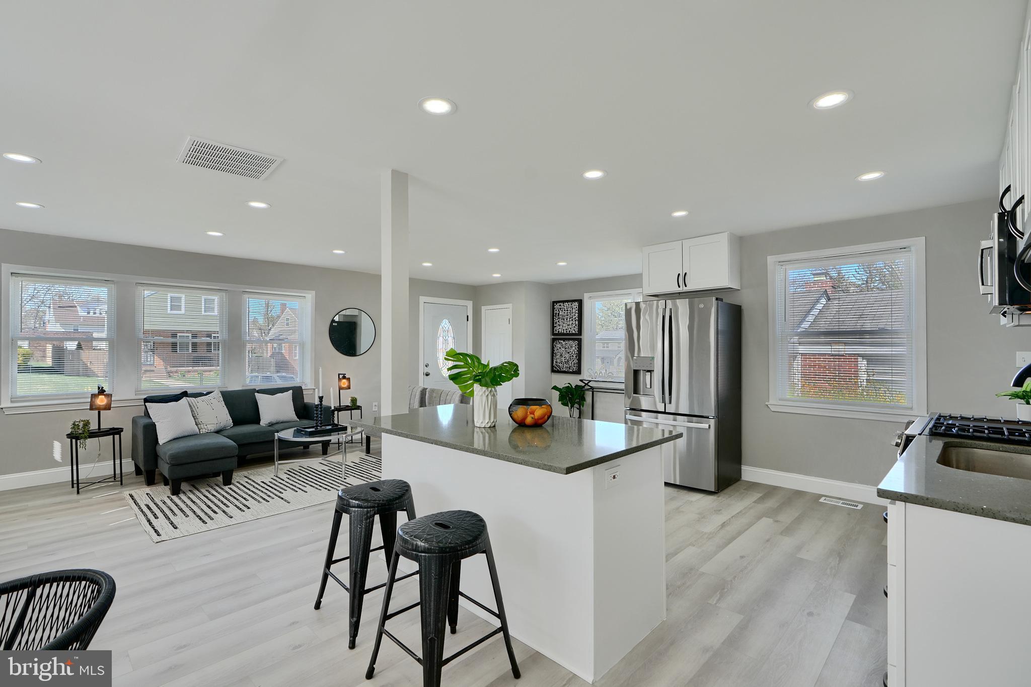 5805 Key Avenue Baltimore, MD 21215 - Photo 1 of 39 a living room with furniture and a flat screen tv