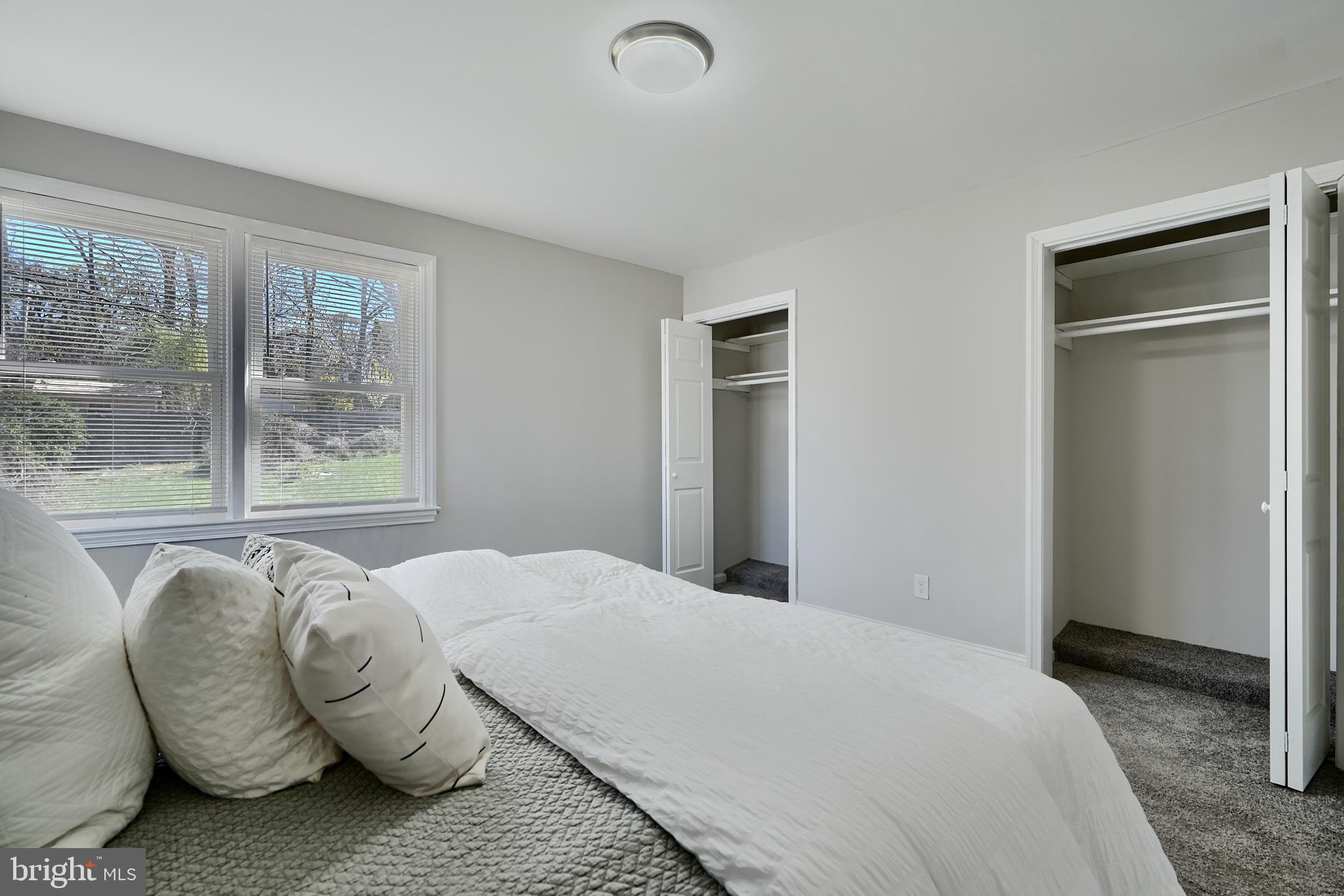 5805 Key Avenue Baltimore, MD 21215 - Photo 21 of 39 a bedroom with a bed and glass window