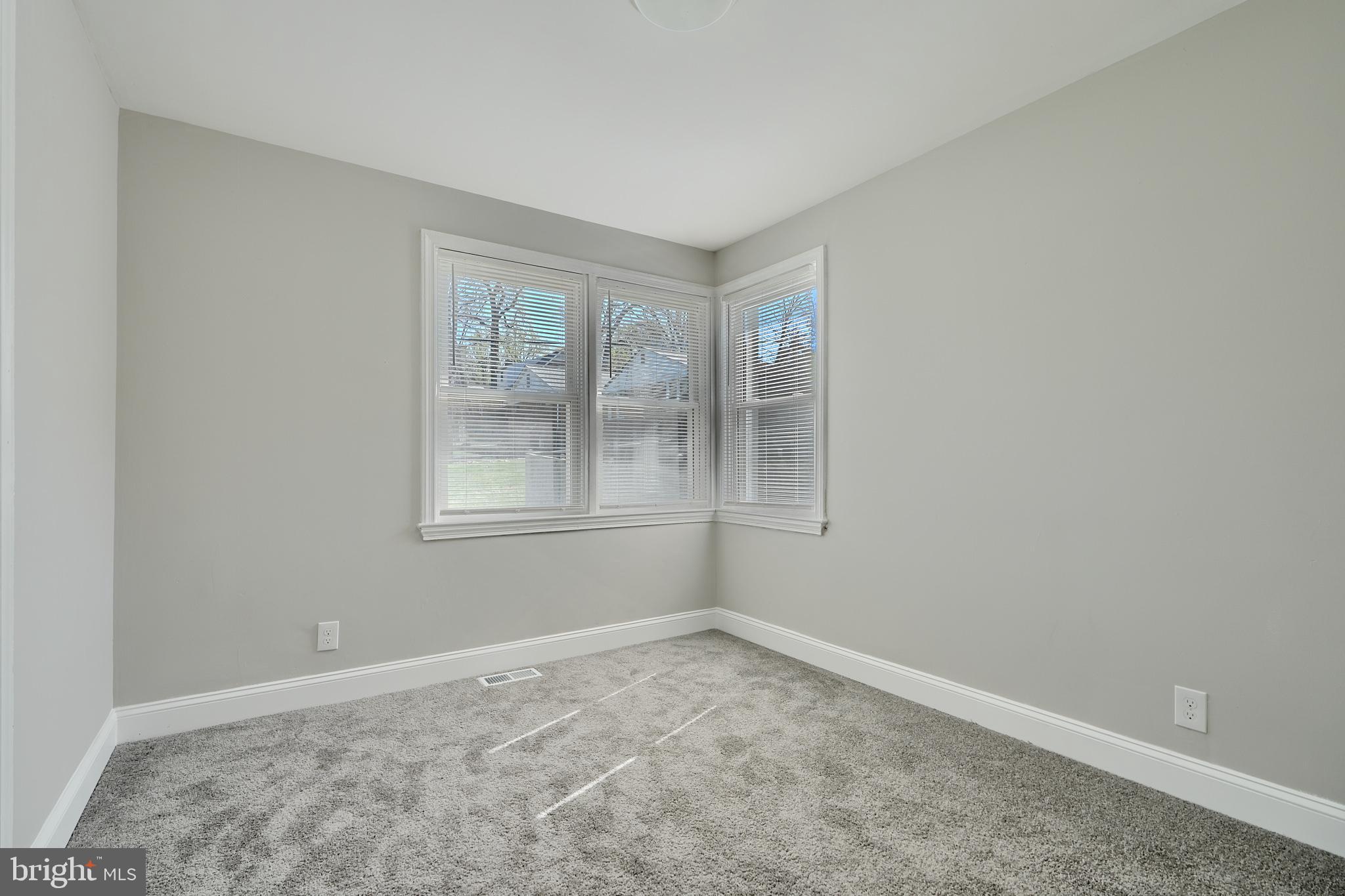 5805 Key Avenue Baltimore, MD 21215 - Photo 24 of 39 a view of an empty room with a window