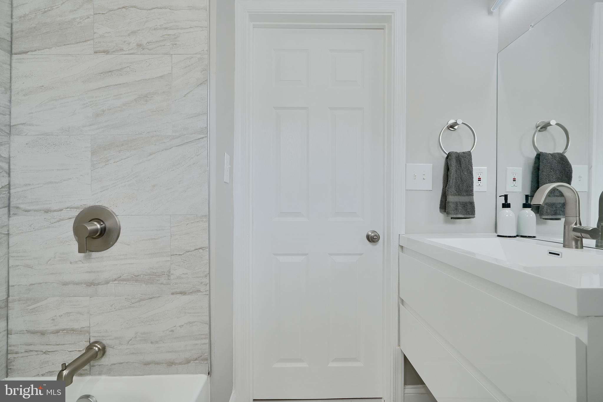 5805 Key Avenue Baltimore, MD 21215 - Photo 26 of 39 a bathroom with a sink and mirror