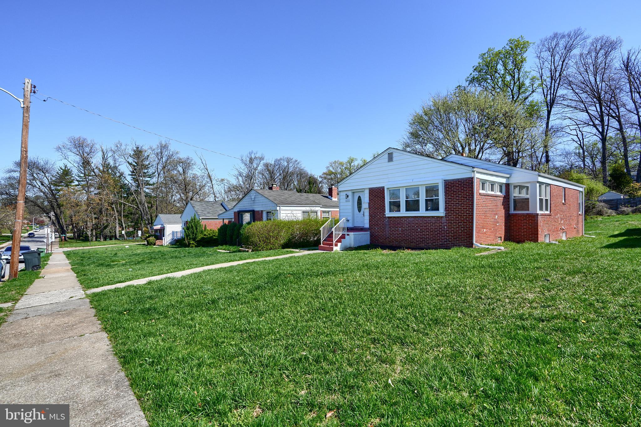 5805 Key Avenue Baltimore, MD 21215 - Photo 37 of 39 a front view of a house with a yard and trees