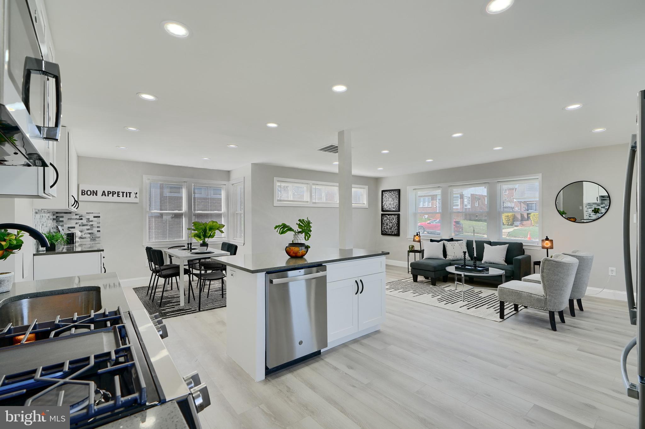 5805 Key Avenue Baltimore, MD 21215 - Photo 10 of 39 a living room with lots of furniture and a wooden floor