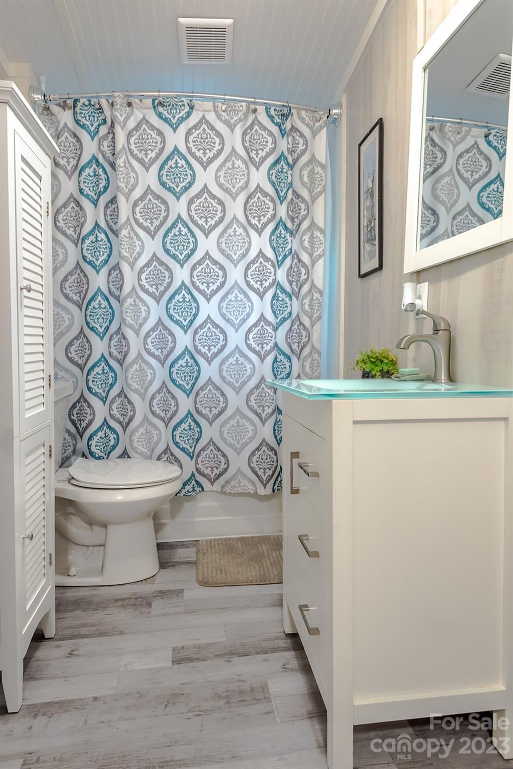 653 Sand Hill Road Asheville, NC 28806 - Photo 20 of 27 a bathroom with a sink toilet and shower