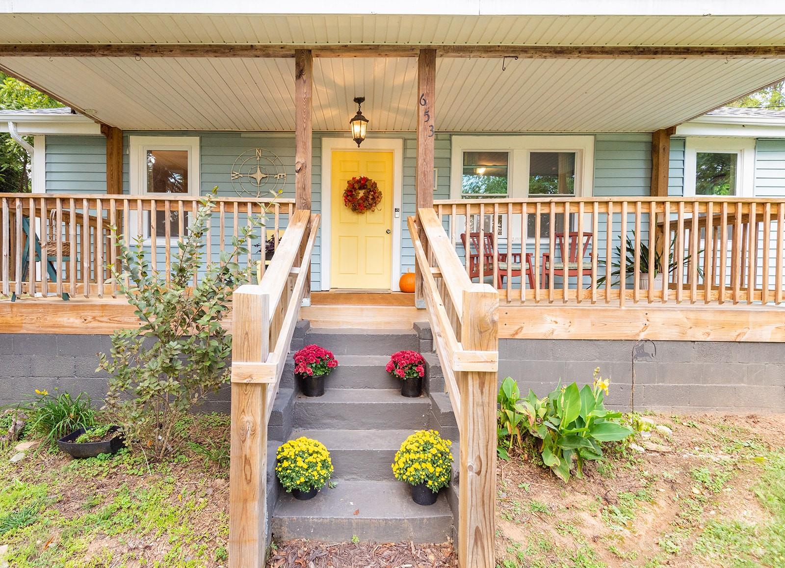 653 Sand Hill Road Asheville, NC 28806 - Photo 2 of 27 a front view of a house with a yard