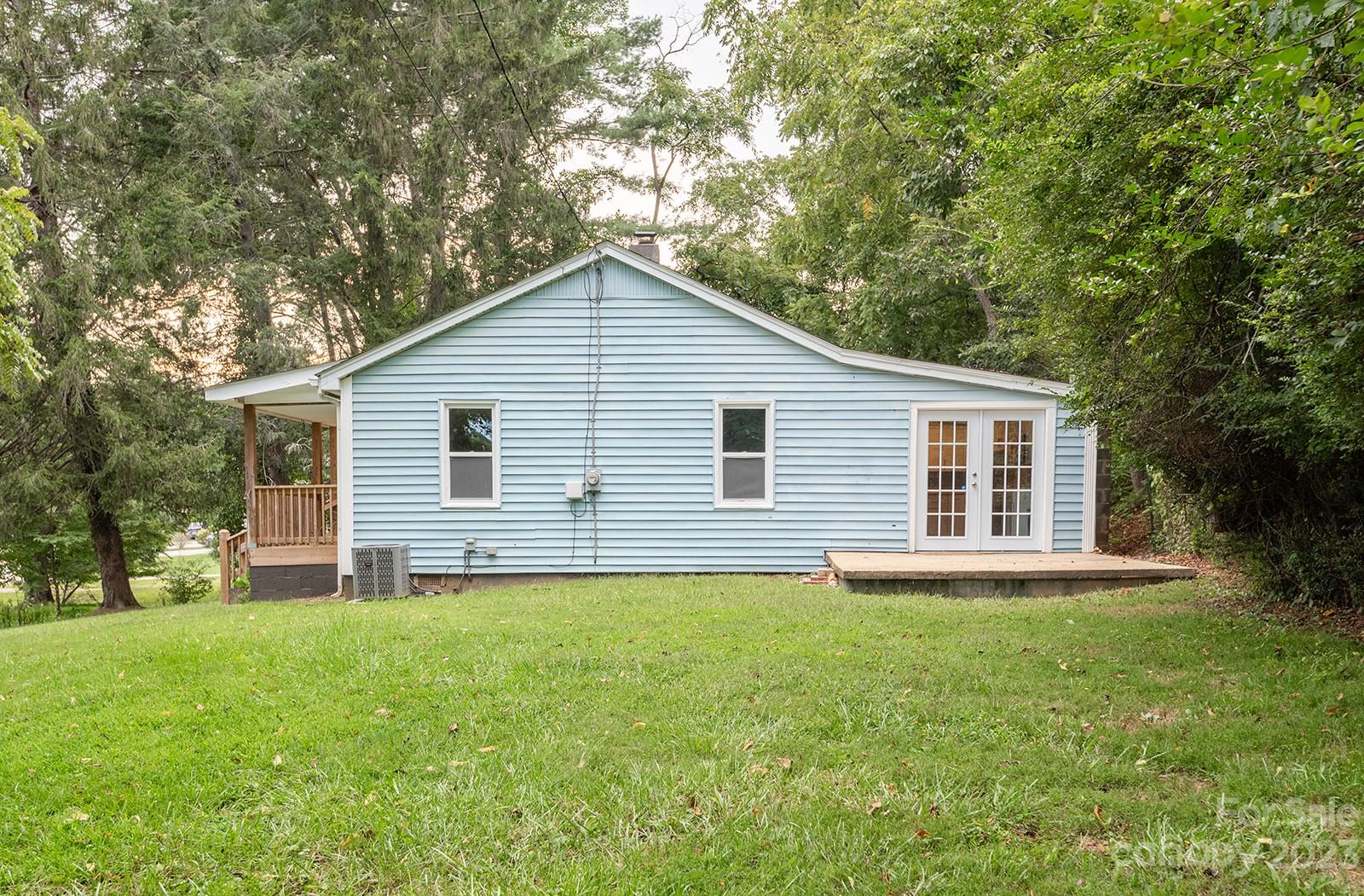 653 Sand Hill Road Asheville, NC 28806 - Photo 25 of 27 a view of a house with a yard