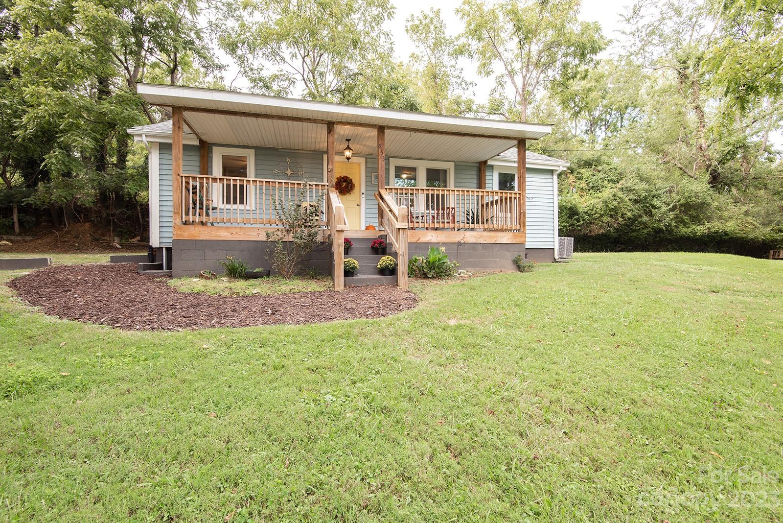 653 Sand Hill Road Asheville, NC 28806 - Photo 26 of 27 a view of a house with backyard porch and sitting area