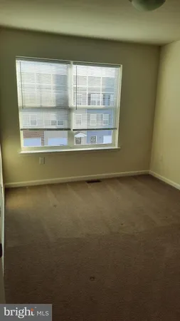 a view of a room that has a window