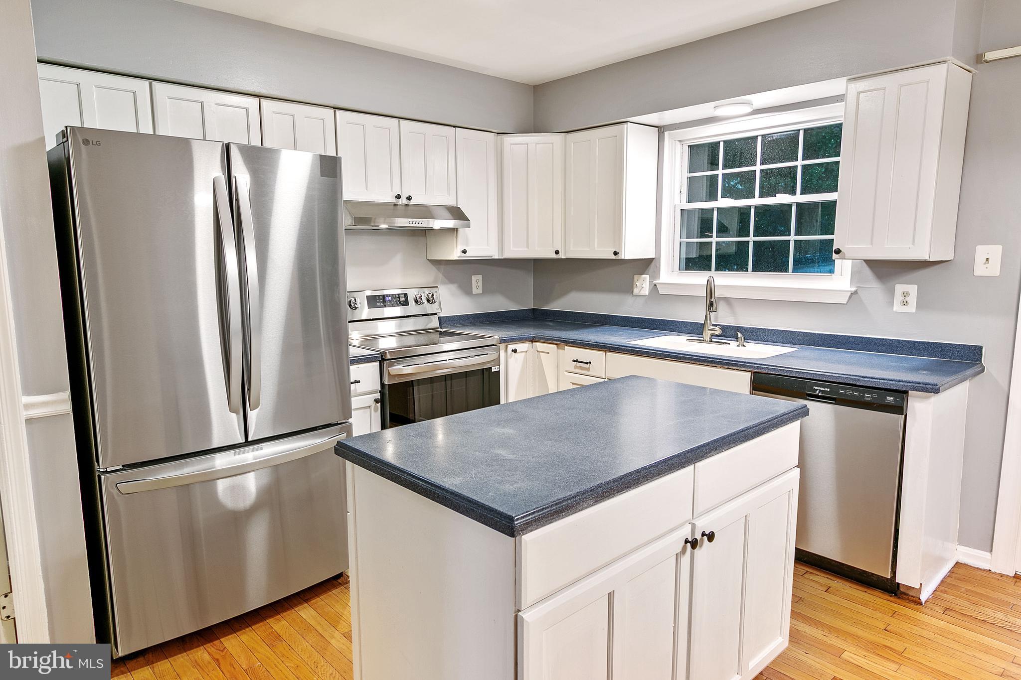 4 Habersham Court Silver Spring, MD 20906 - Photo 7 of 21 Kitchen with new refrigerator and oven