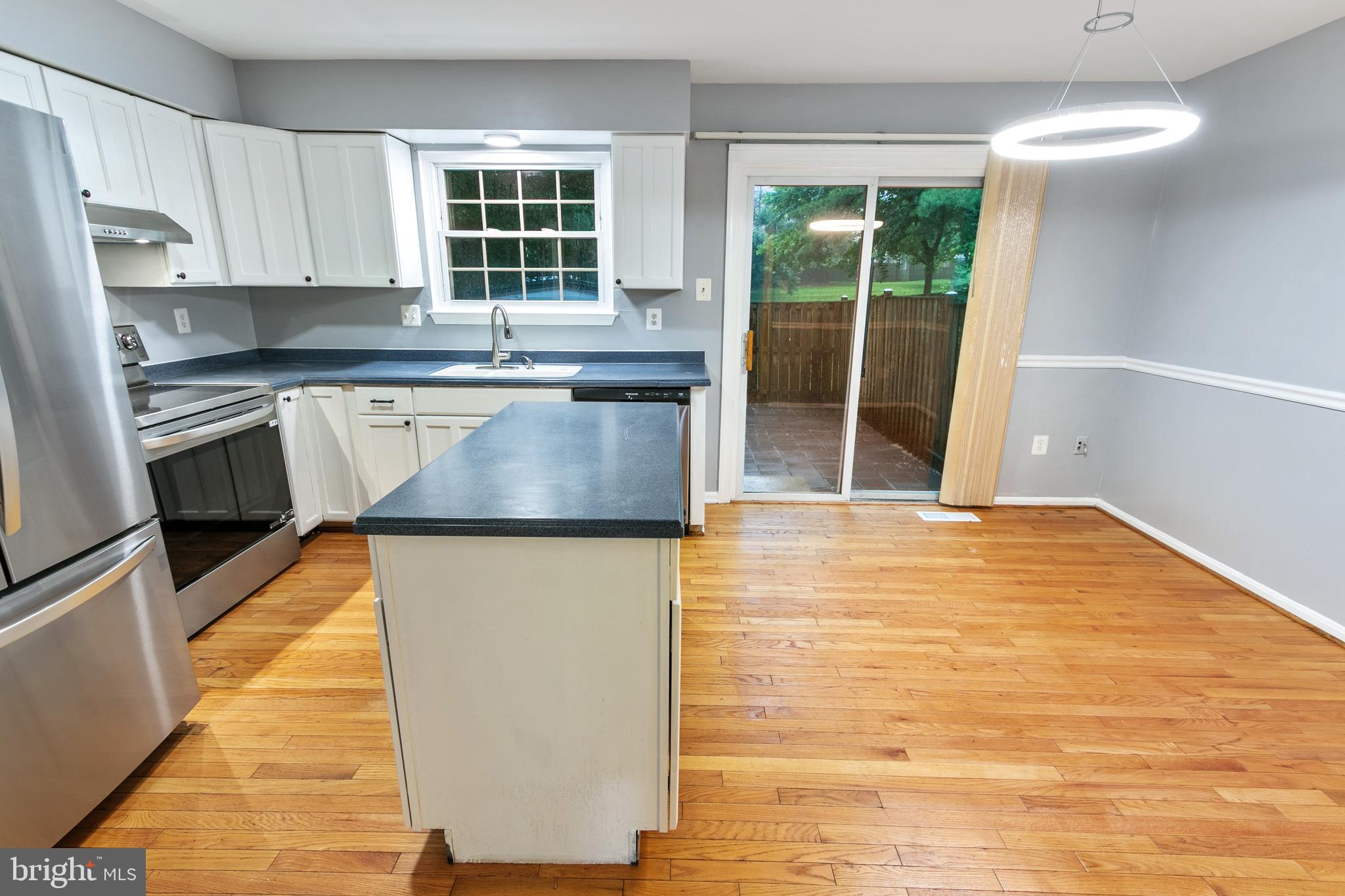 4 Habersham Court Silver Spring, MD 20906 - Photo 8 of 21 Kitchen island and dining room