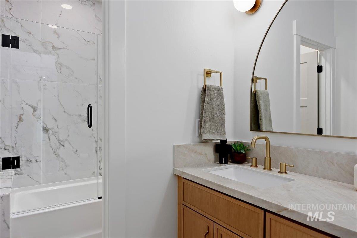 2005 Sparrow Street Rupert, ID 83350 - Photo 25 of 30 Bathroom vanity featuring a light wood-finish cabinet with an integrated rectangular sink