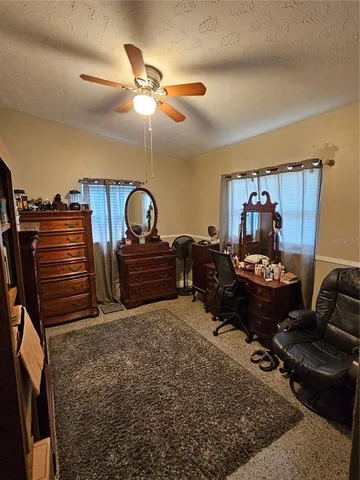 a bed room with furniture and a chandelier