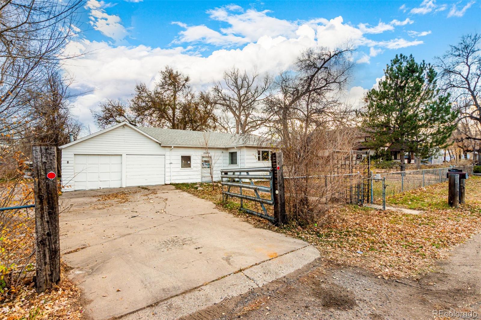 10480 West 47th Avenue Wheat Ridge, CO 80033 - Photo 1 of 29 a view of a outdoor space with wooden fence