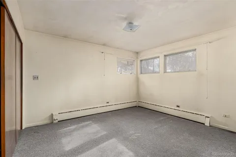 a kitchen with a refrigerator and a sink