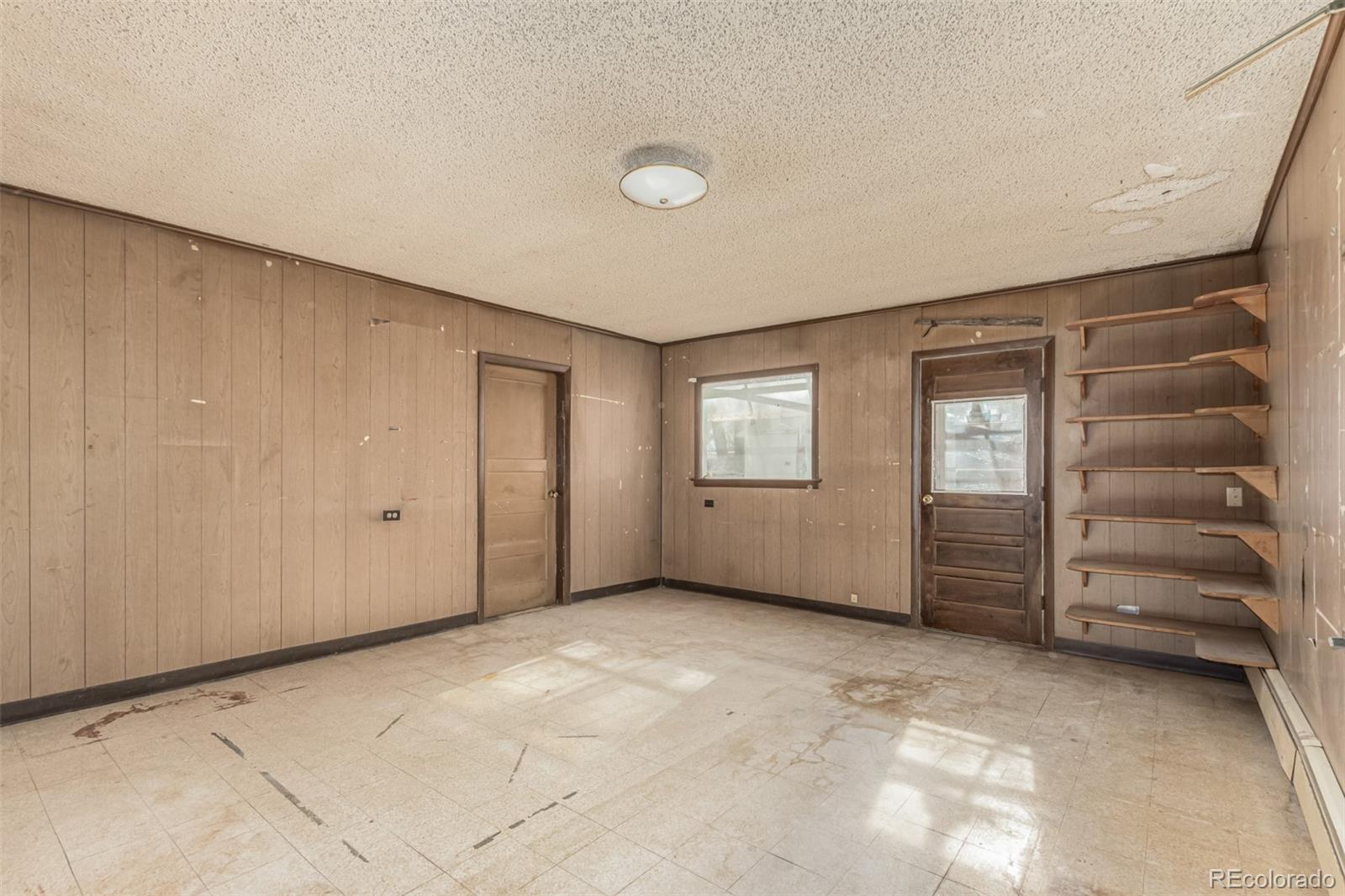 10480 West 47th Avenue Wheat Ridge, CO 80033 - Photo 20 of 29 a view of an empty room with a window
