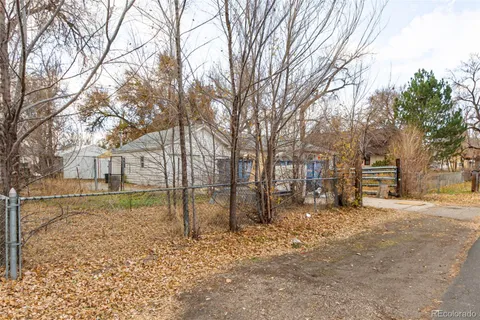 a view of a yard covered in snow