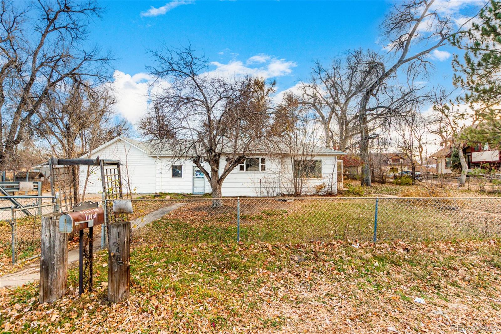 10480 West 47th Avenue Wheat Ridge, CO 80033 - Photo 4 of 29 a view of a yard with snow on the road