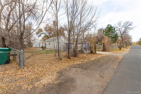 a view of a yard covered with snow in the background