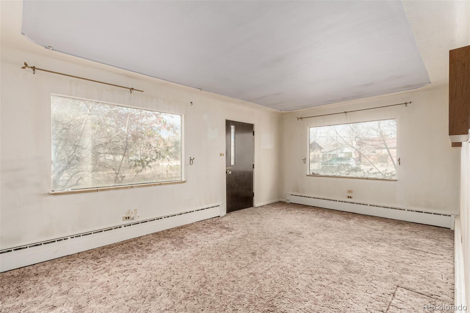 10480 West 47th Avenue Wheat Ridge, CO 80033 - Photo 5 of 29 a view of an empty room with window