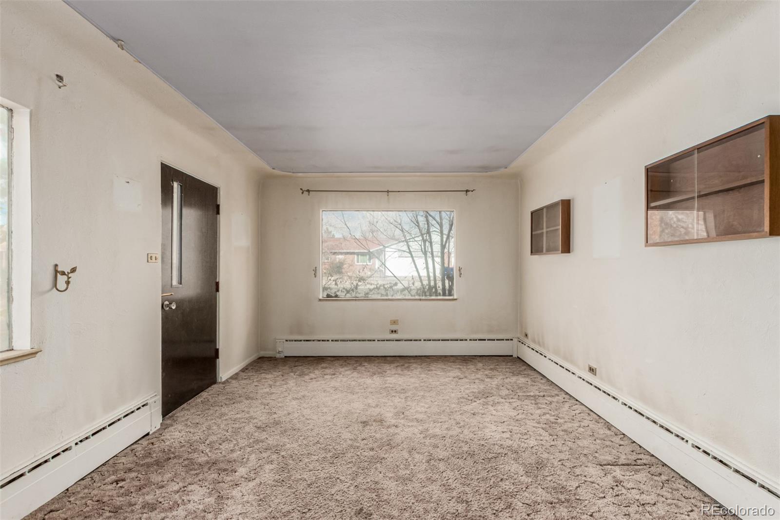 10480 West 47th Avenue Wheat Ridge, CO 80033 - Photo 6 of 29 an empty room with windows