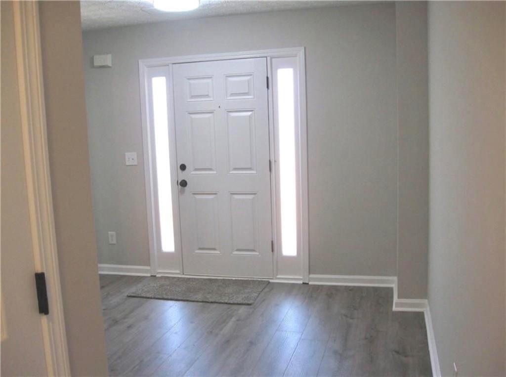 2225 Blue Ridge Lane Conyers, GA 30012 - Photo 13 of 40 an empty room with wooden floor & closet area