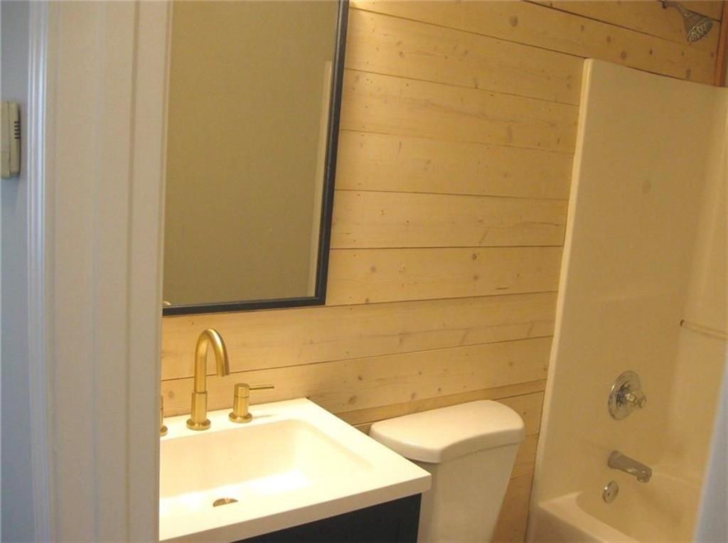 2225 Blue Ridge Lane Conyers, GA 30012 - Photo 14 of 40 a bathroom with a sink and a mirror