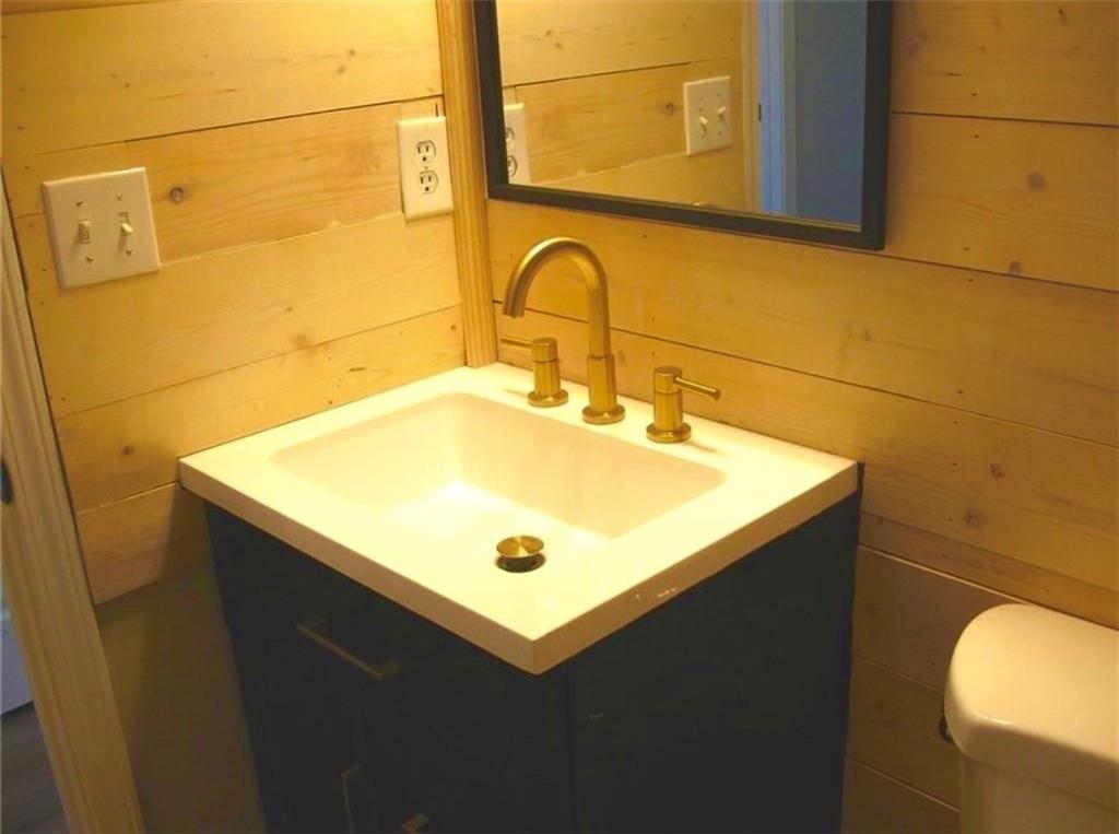 2225 Blue Ridge Lane Conyers, GA 30012 - Photo 15 of 40 a bathroom with a sink and mirror
