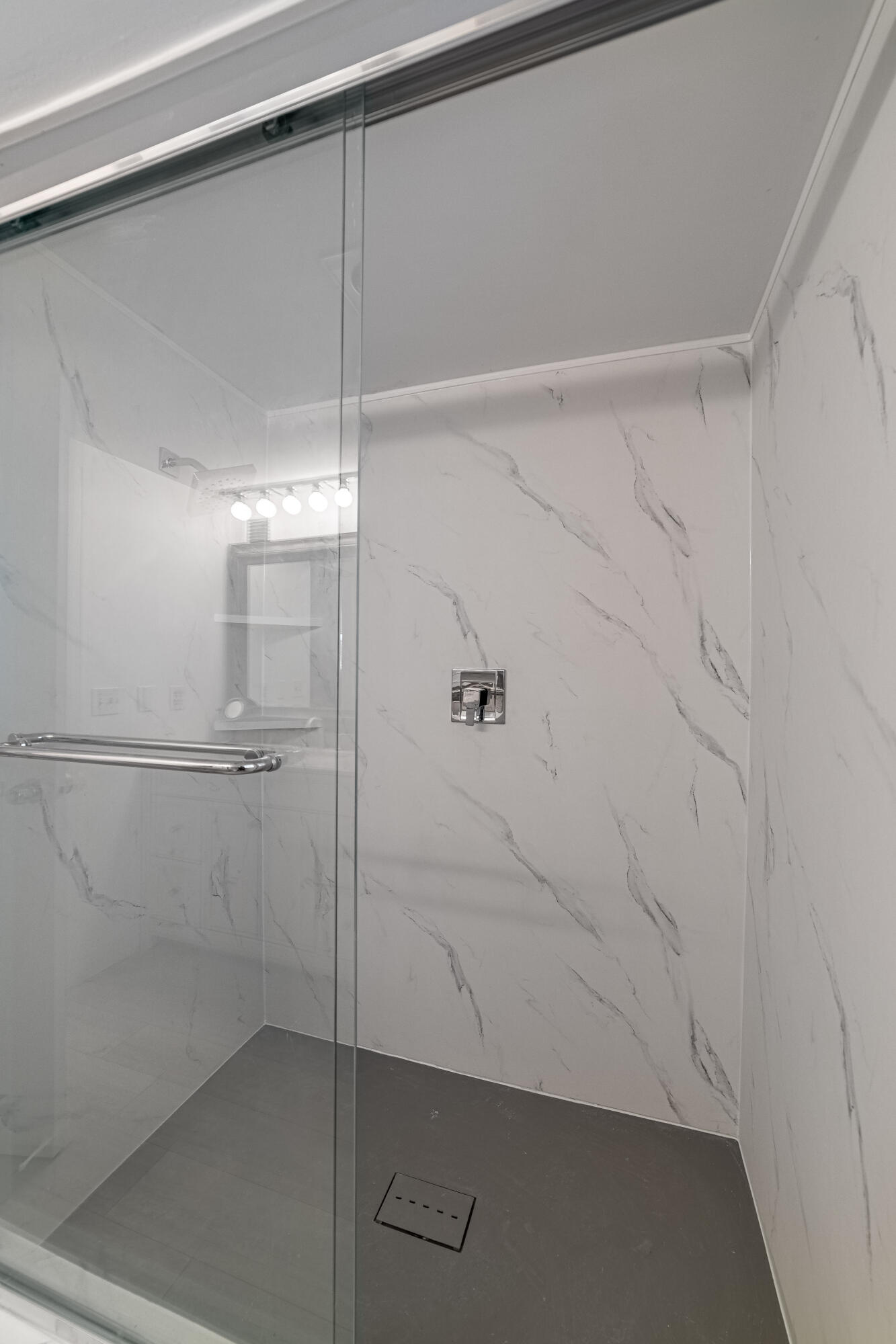 3475 South Ocean Boulevard, Unit 201 Palm Beach, FL 33480 - Photo 14 of 28 a bathroom with a glass shower door