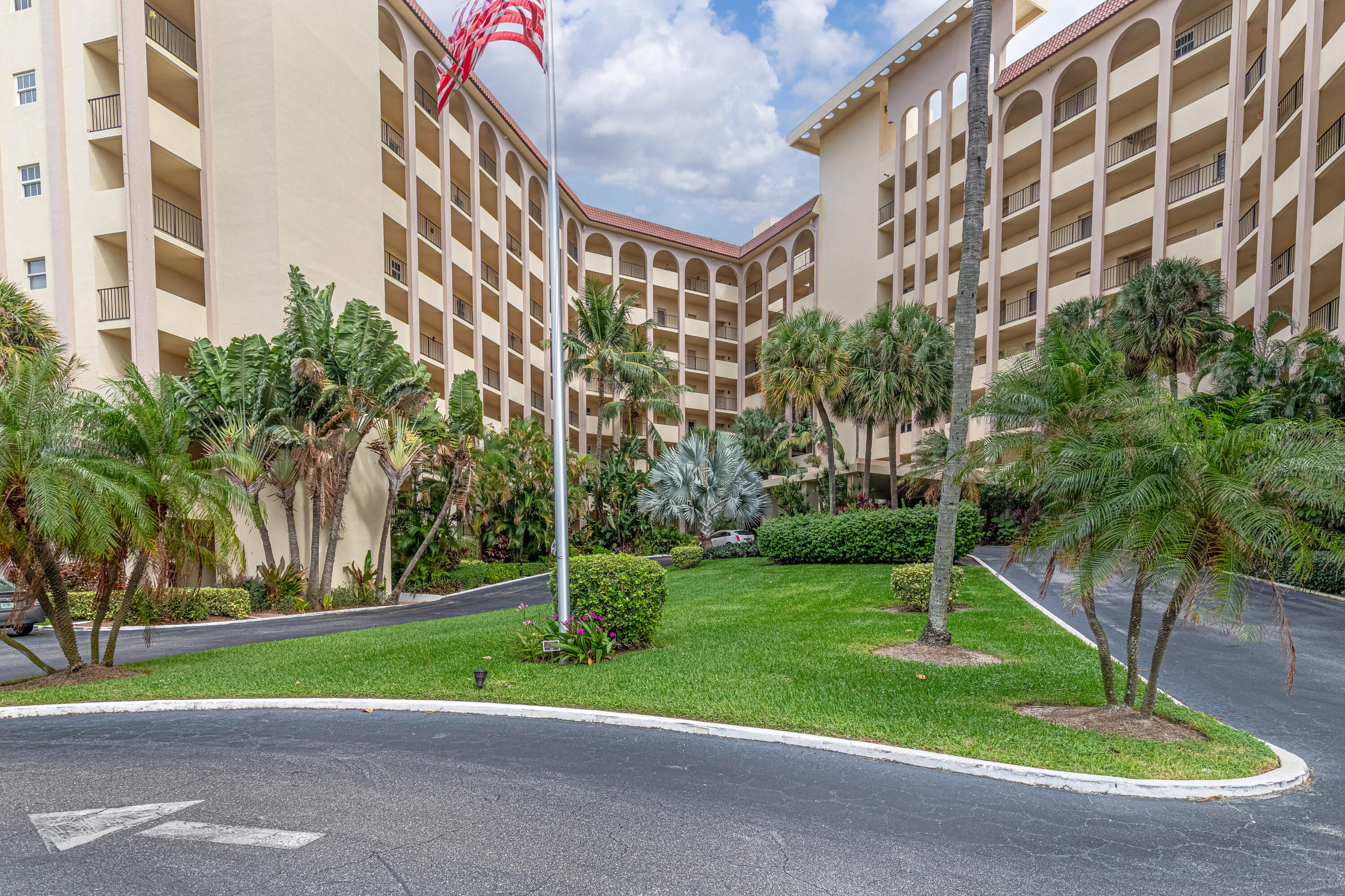 3475 South Ocean Boulevard, Unit 201 Palm Beach, FL 33480 - Photo 16 of 28 a view of building with a yard