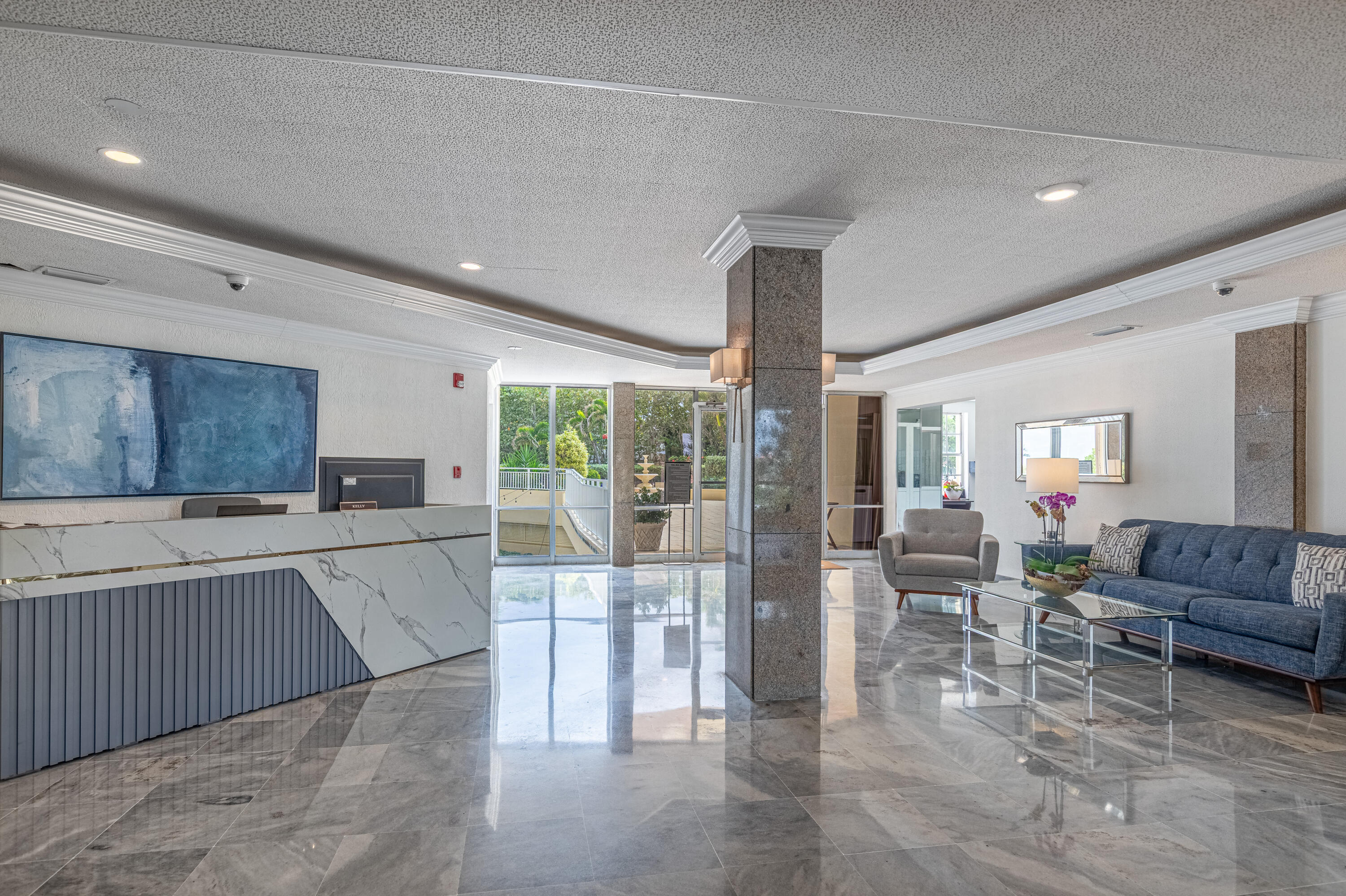 3475 South Ocean Boulevard, Unit 201 Palm Beach, FL 33480 - Photo 19 of 28 a living room with furniture a large window and wooden floors