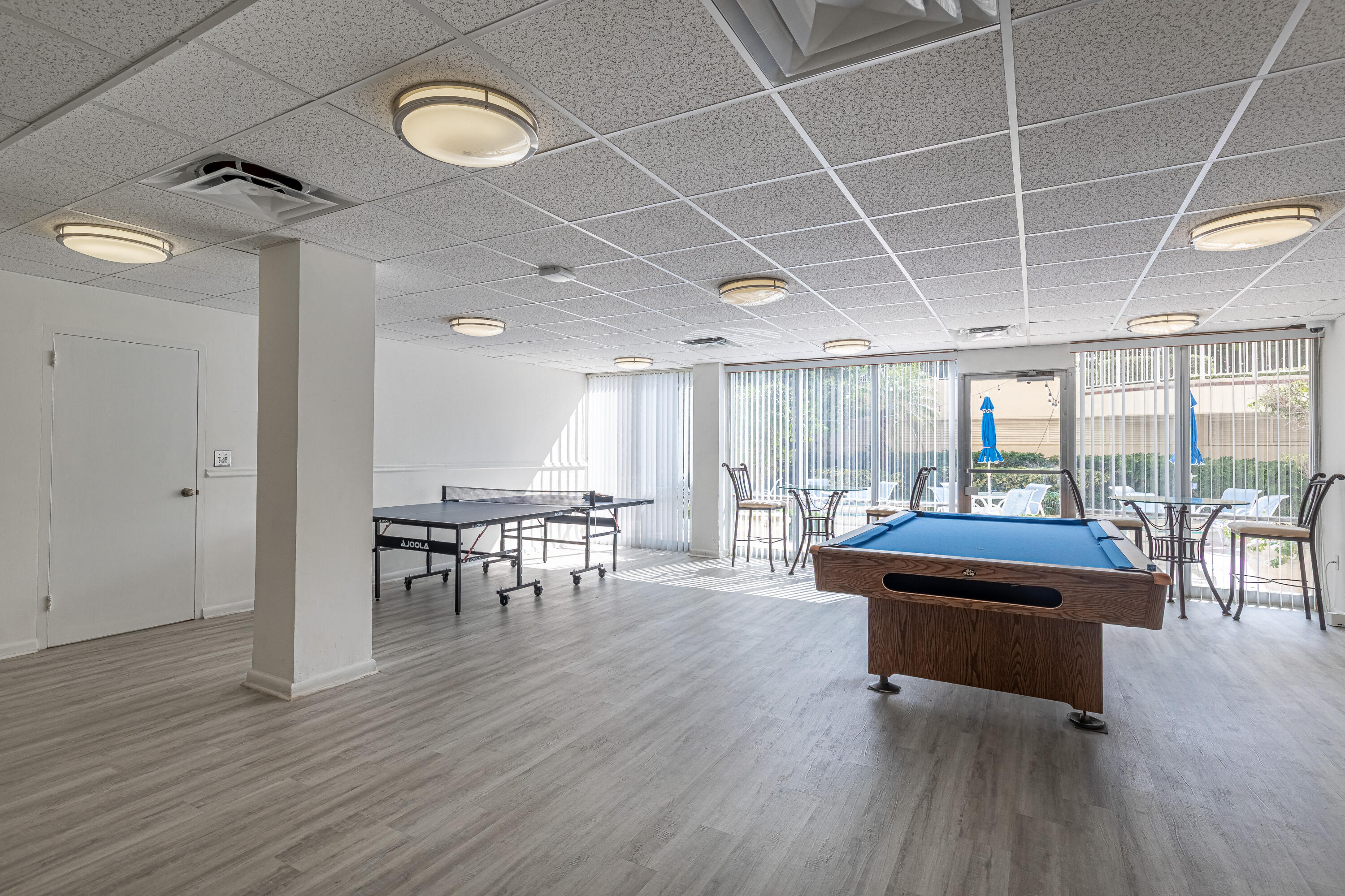 3475 South Ocean Boulevard, Unit 201 Palm Beach, FL 33480 - Photo 21 of 28 a living room with furniture a table and wooden floors
