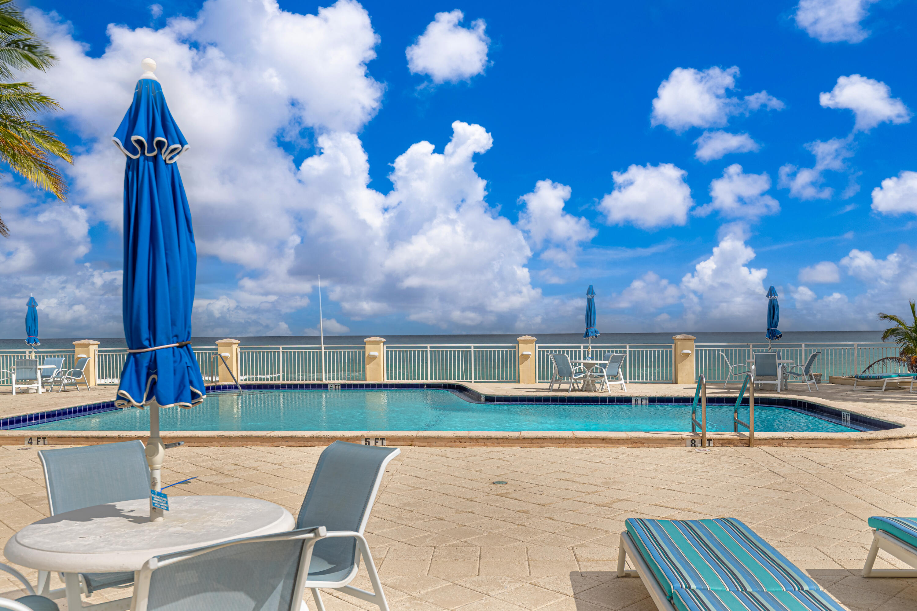 3475 South Ocean Boulevard, Unit 201 Palm Beach, FL 33480 - Photo 25 of 28 a view of a swimming pool with a patio and a yard
