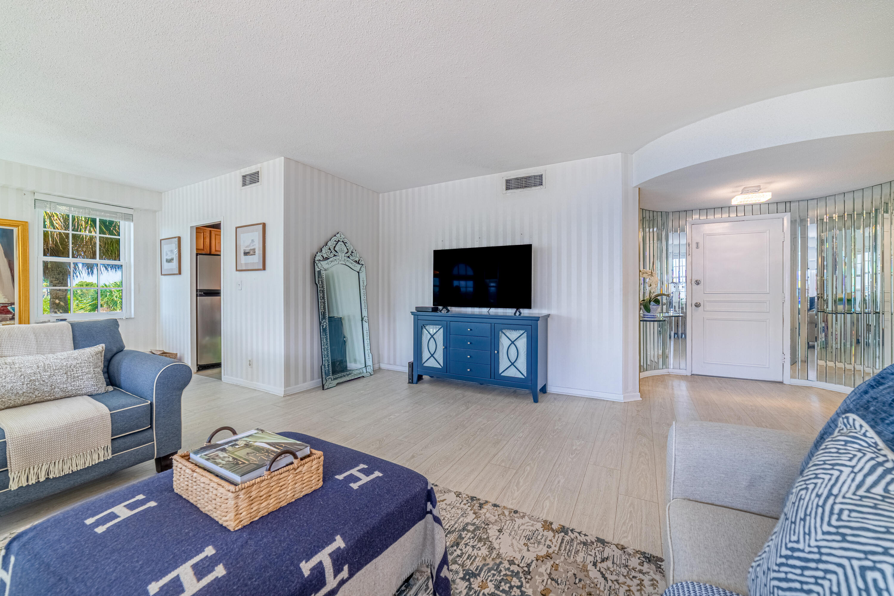3475 South Ocean Boulevard, Unit 201 Palm Beach, FL 33480 - Photo 3 of 28 a living room with furniture and a flat screen tv