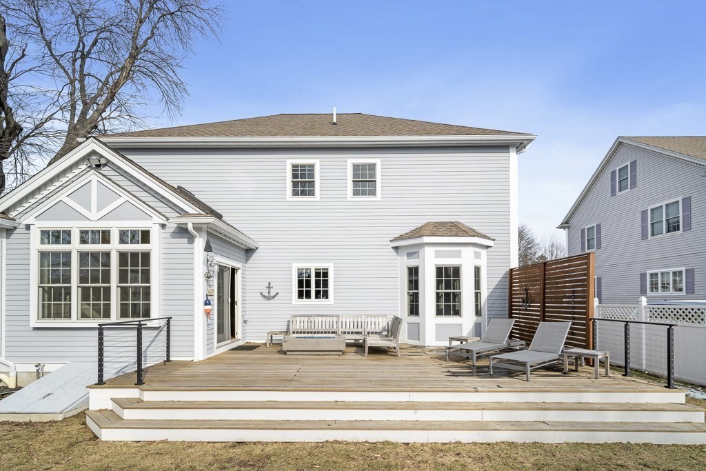 4 Colonial Drive Arlington, MA 02474 - Photo 16 of 19 a front view of a house with yard and windows
