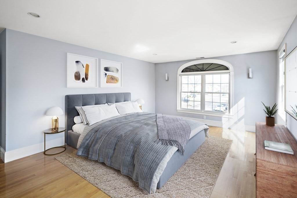 4 Colonial Drive Arlington, MA 02474 - Photo 9 of 19 a spacious bedroom with a large bed and a window