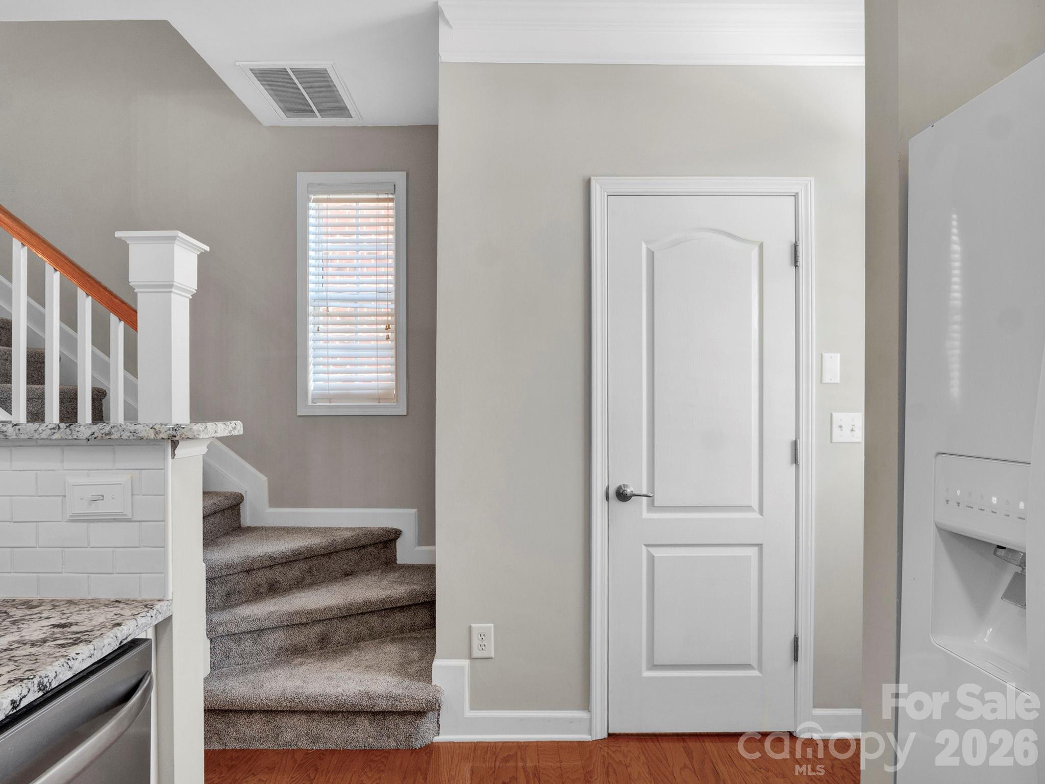 140 Singleton Road Mooresville, NC 28117 - Photo 7 of 17 an entryway with wooden floor and cabinet