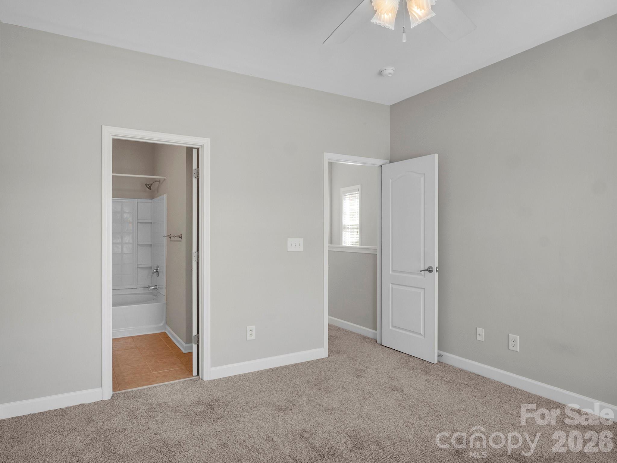 140 Singleton Road Mooresville, NC 28117 - Photo 10 of 17 an empty room with closet and a chandelier fan