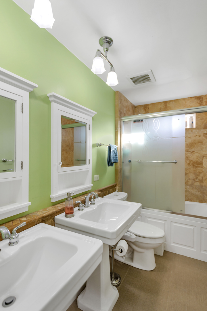 1548 Old Forge Road Bartlett, IL 60103 - Photo 36 of 50 a bathroom with a sink and a mirror