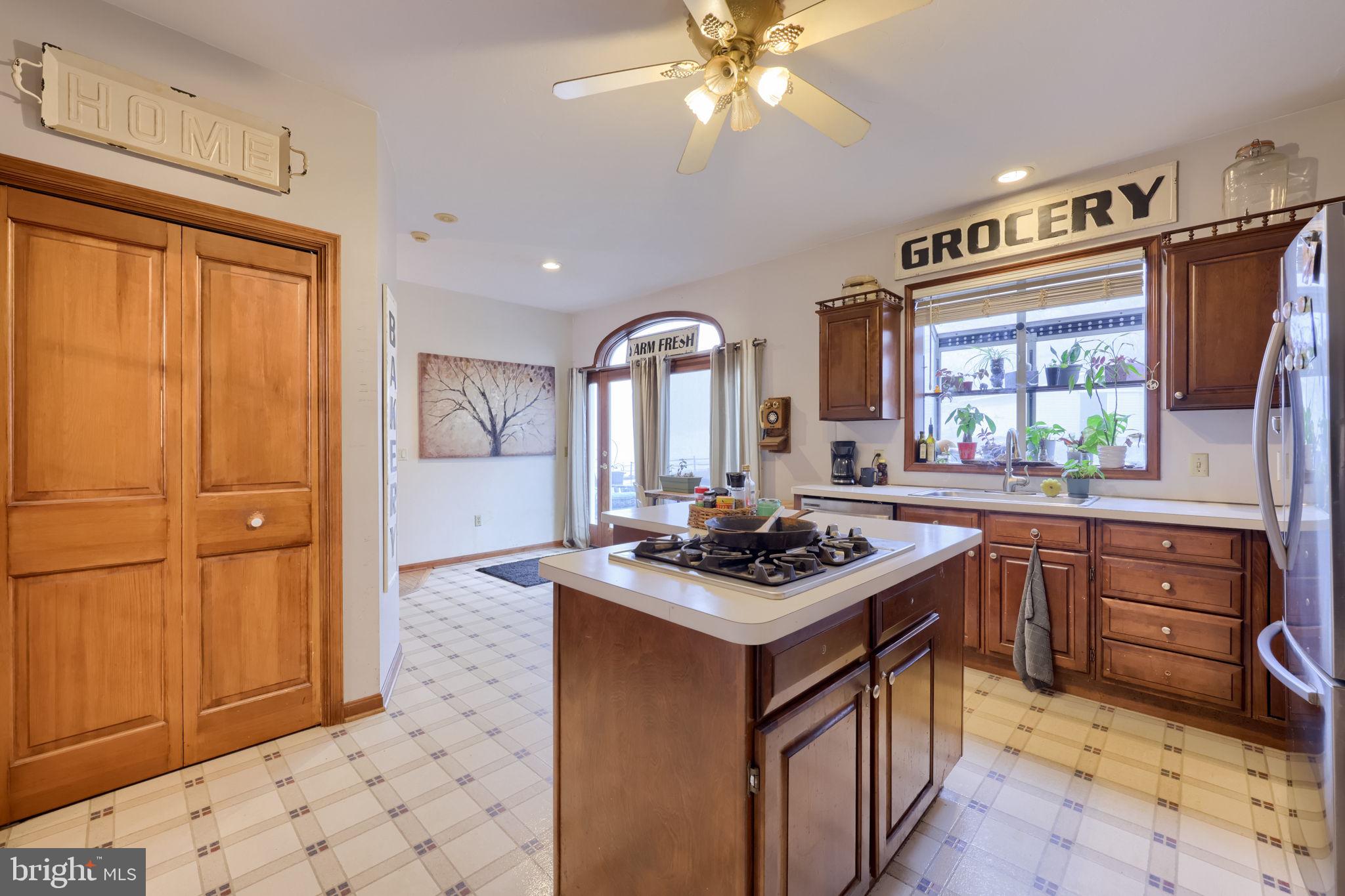180 Springvale Road Red Lion, PA 17356 - Photo 16 of 70 a kitchen with stainless steel appliances granite countertop a stove a sink and a refrigerator
