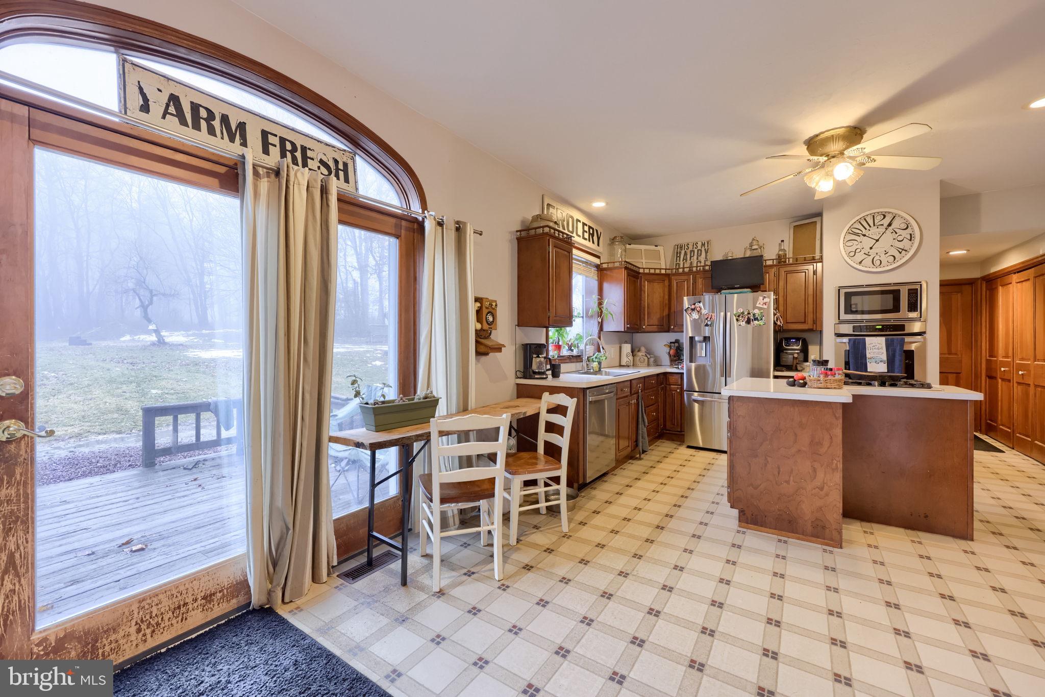 180 Springvale Road Red Lion, PA 17356 - Photo 18 of 70 a living room with stainless steel appliances kitchen island granite countertop a refrigerator and cabinets