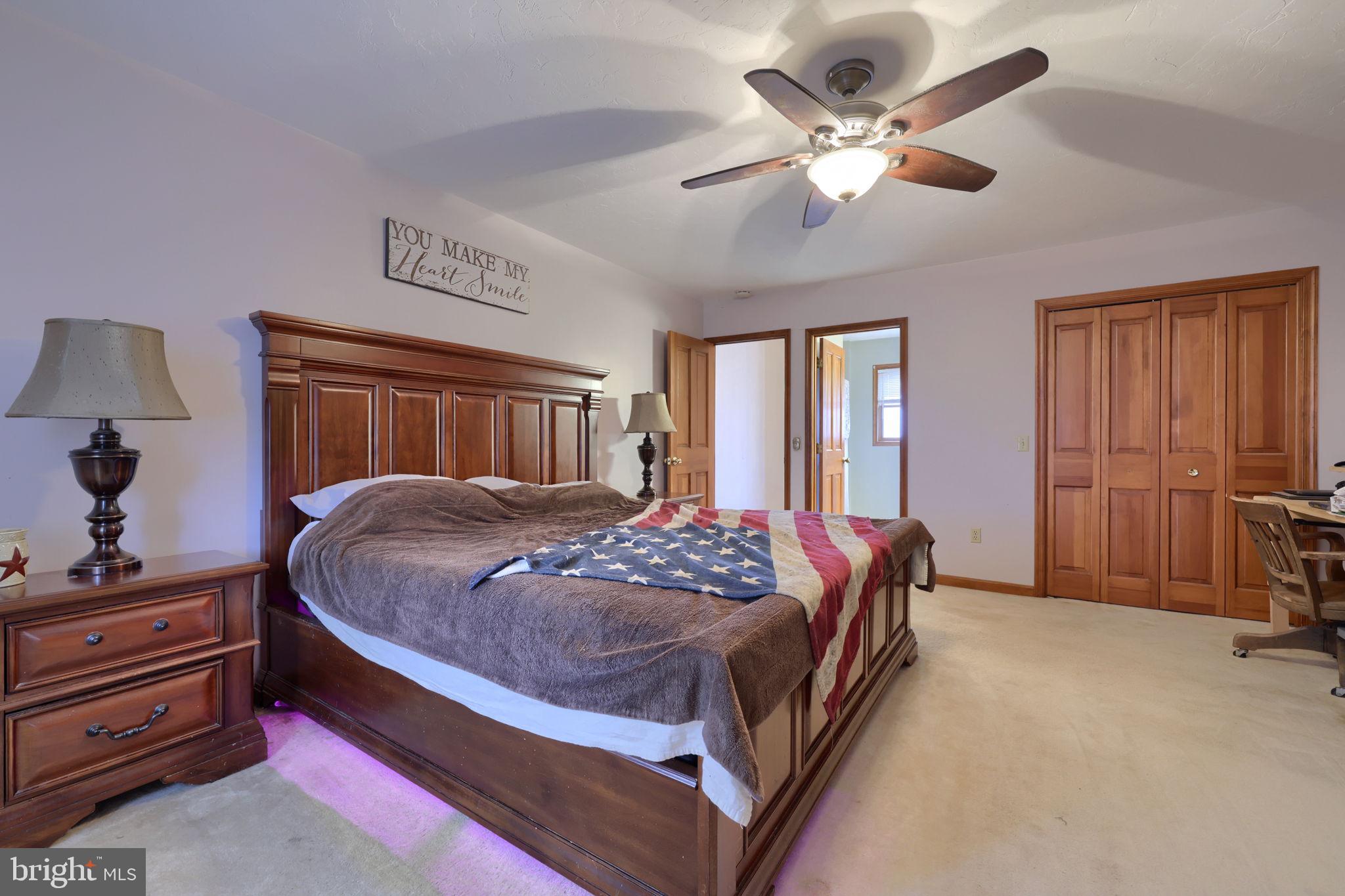 180 Springvale Road Red Lion, PA 17356 - Photo 26 of 70 a bedroom with a bed and a chandelier