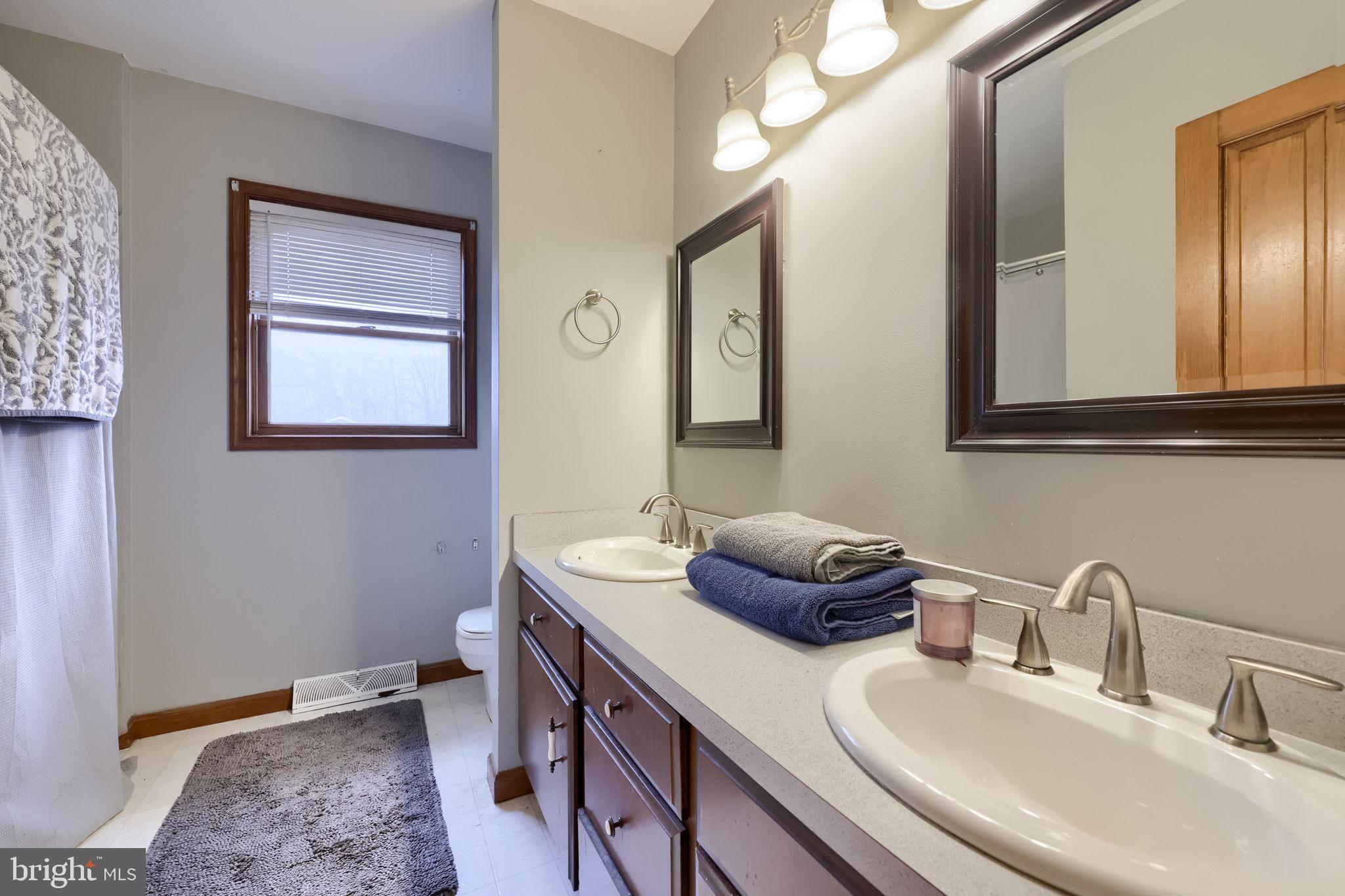 180 Springvale Road Red Lion, PA 17356 - Photo 27 of 70 a bathroom with a double vanity sink and a mirror