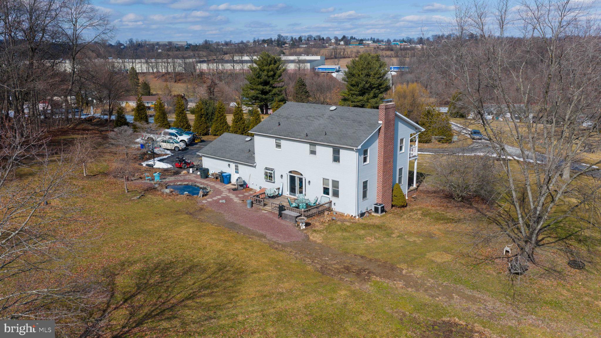180 Springvale Road Red Lion, PA 17356 - Photo 62 of 70 an aerial view of a house with a yard and lake view
