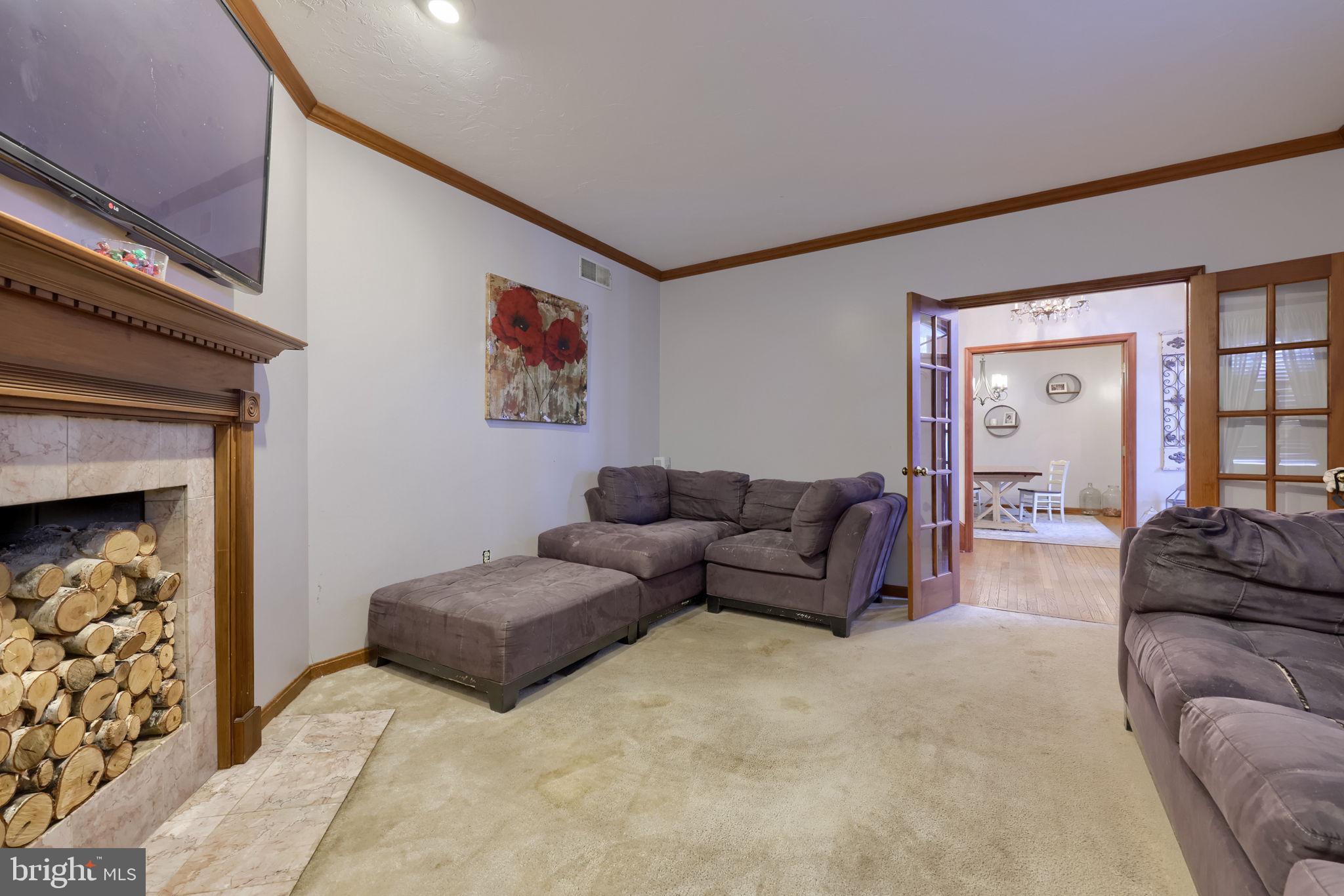 180 Springvale Road Red Lion, PA 17356 - Photo 8 of 70 a living room with furniture and a fireplace