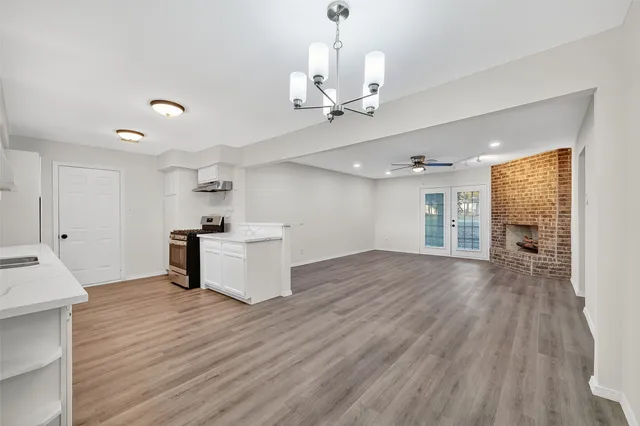 a view of a kitchen with a sink and a window