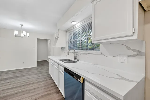 a kitchen with a sink and a refrigerator