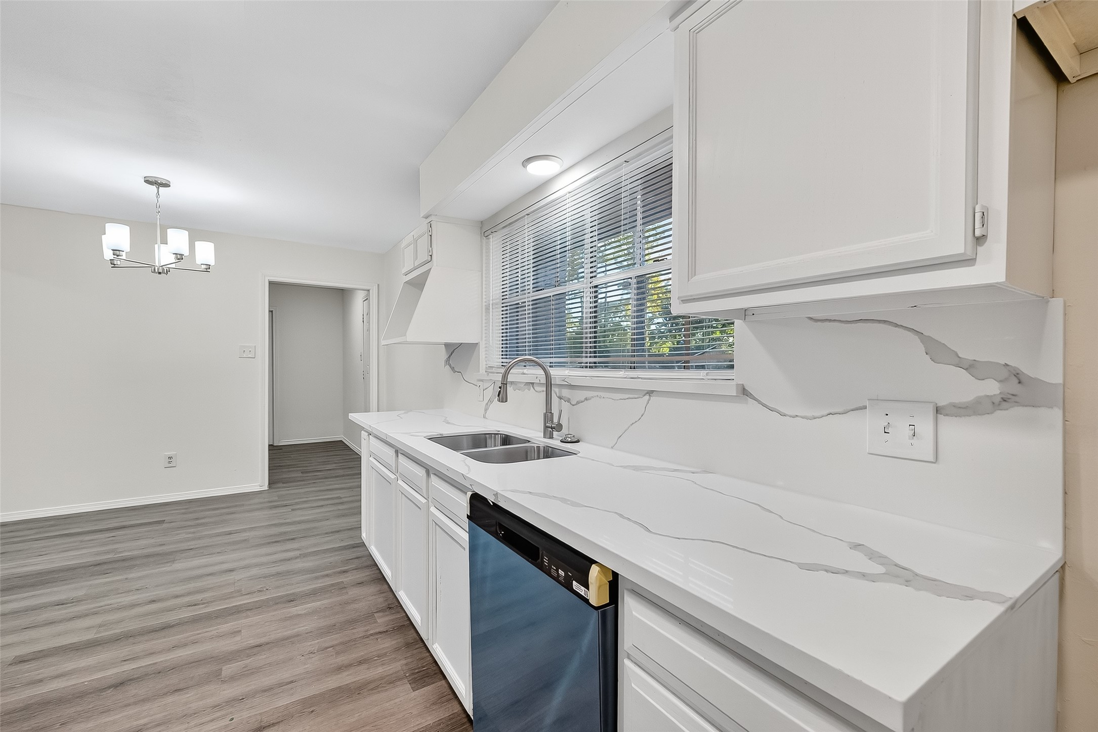 26522 Hillside Drive Spring, TX 77386 - Photo 18 of 45 a kitchen with a sink and a refrigerator